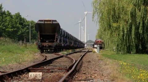 Time-laps wind turbine and train wagons Stock Footage 40207870
