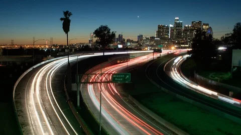 Time lapse of 101 and I-10 merge area traffic in Los Angeles, California at dusk Stock Footage 101756873