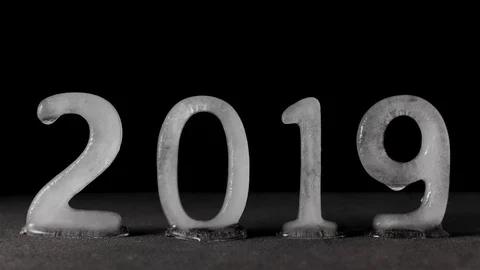 Time lapse of 2019 text written with ice characters melting. Conceptual video Stock Footage 121325348