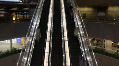 Time lapse of 3 busy escalators with zoom and pan up Stock Footage 49604443