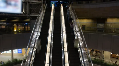 Time lapse of 3 busy escalators Stock Footage 49604543