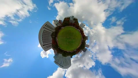 Time-lapse of 360-degree shot of green grass of public park and urban building, Stock Footage 167317827
