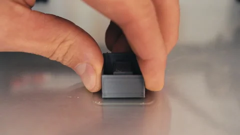 Time-Lapse 3D Printing and Hand Removing Finished Part from Printer Table Stock Footage 251175356