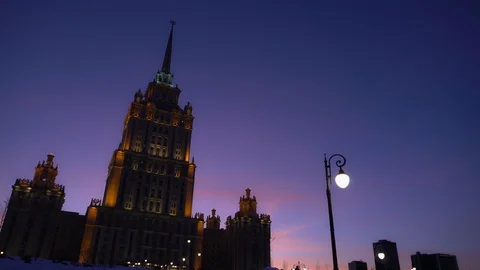 Time Lapse, 4K. Art Deco building One of the Stalinist skyscrapers. Day to night Stock Footage 119380181