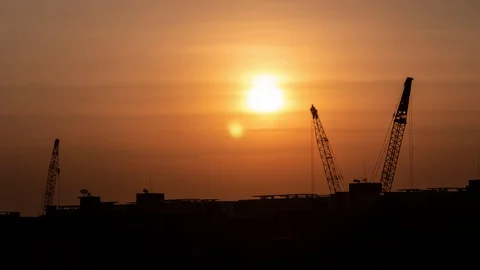 Time-lapse 4K : Cranes lifting containers background sunset in the evening. Stock Footage 121773523