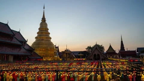 Time Lapse 4k : Day to night - Wat Phra That Hariphunchai in twilight Stock Footage 164129648
