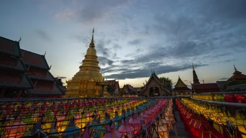 Time Lapse 4k : Day to night - Wat Phra That Hariphunchai in twilight Stock Footage 164129716