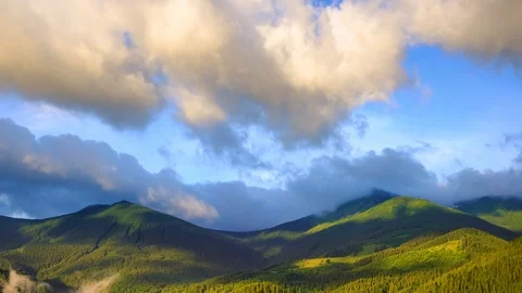 Time lapse 4K footage of cloudy sunrise over mountain ridge Stock Footage 92239330