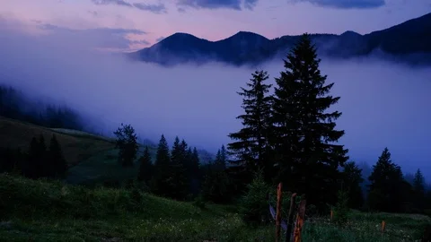 Time lapse 4K video of clouds and fog moving at mountain valley Stock Footage 91930323