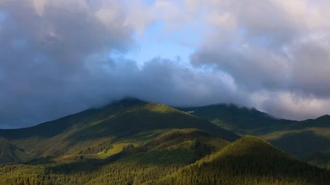 Time lapse 4K video of clouds and fog moving at mountain valley Stock Footage 91930630