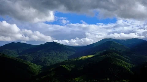 Time lapse 4K video of clouds and fog moving at mountain valley Stock Footage 92077204
