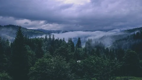 Time lapse 4K video of clouds and fog moving at mountain valley Video stock 92077248