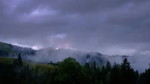 Time lapse 4K video of clouds and fog moving at mountain valley Stock Footage 92077281