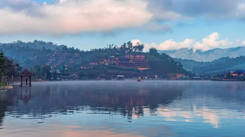 Time lapse 4k. View lake and morning fog in Ban rakthai village Stock Footage 146225604