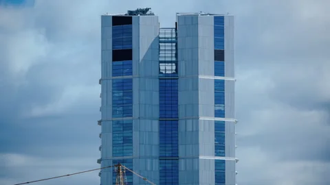 Time lapse about the Mol Campus Tower with moving clouds at Budapest Stock Footage 270955558