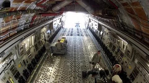 Time lapse of activities in the cargo bay of a military cargo plane. Stock Footage 74800834