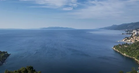 Time lapse of Adriatic bay with wind blowing into the open sea toward an island Stock Footage 113333686