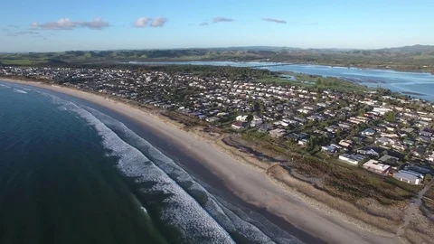 Time lapse aerial of Omaha Beach and Whangateau Harbour, New Zealand Stock Footage