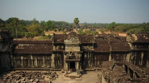 Time Lapse Aerial View of Angkor Wat Temple Tourist People Visit Iconic Landmark Stock Footage 104386609