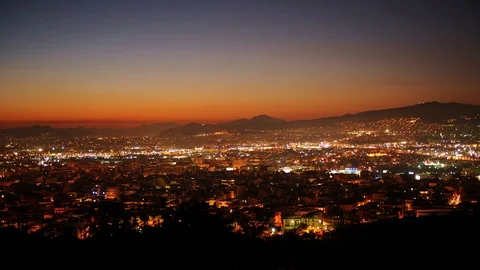 Time Lapse Aerial View of Athens City Rooftops Apartment Buildings Dusk to Night 動画素材 104473497