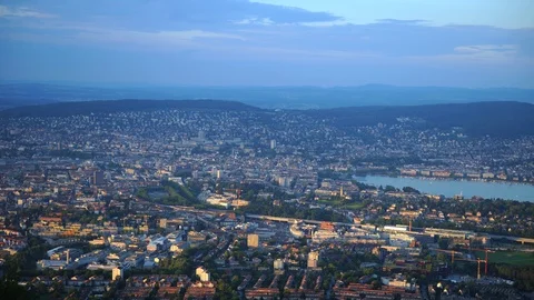 Time Lapse Aerial View Establishing Shot of Zurich City Skyline Dusk to Night Stock Footage 98737161