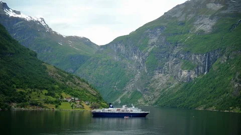Time Lapse Aerial View of Ferry Boat Dock in Geiranger Fjord Stunning Nature Day Video stock 104960925
