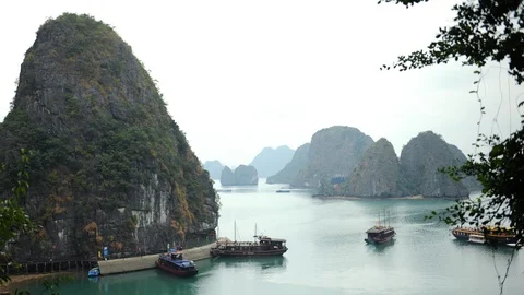 Time Lapse Aerial View of Ha Long Bay Island Vietnamese Junk Boat Surprise Cave Stock Footage 102958586