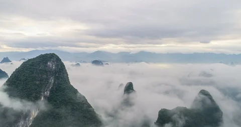 Time lapse of aerial view of Karst mountains and beautiful cloudscape at sunrise Stock Footage 97917650