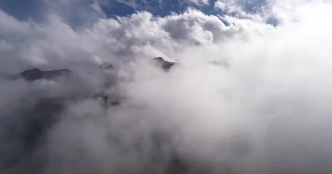Time lapse. Aerial view of misty foggy mountain top. Drone filming hills summit  Stock Footage 80917926