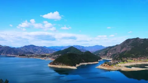 Time-Lapse Aerial View of Rural Lake Surrounded by Countryside Natural Scenery Video stock 341908685