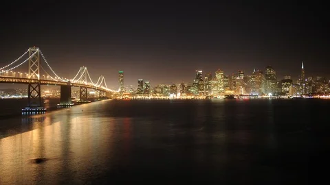 Time Lapse Aerial View of San Francisco Skyline Famous Oakland Bay Bridge Night Stock Footage 90758331