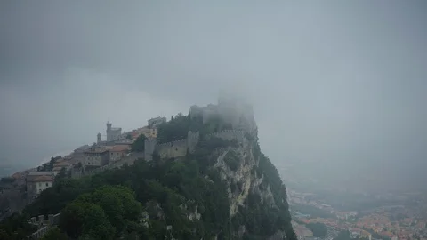 Time Lapse Aerial View of San Marino People Visit Guaita Tower Castle Foggy Day Video stock 102962489