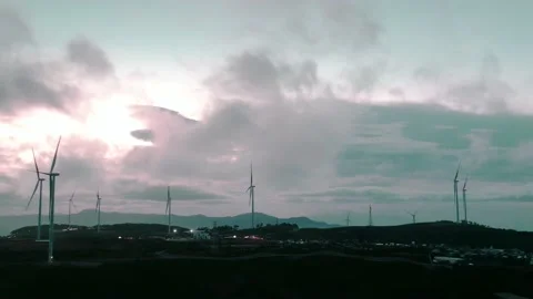 Time lapse aerial view top hill at dawn with fog covering small village Stock Footage 197496528