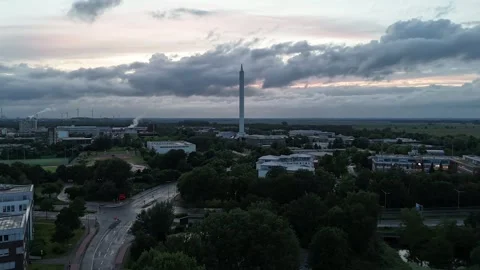 Time lapse aerial view of ZARM Fallturm tower over Bremen technology park Stockbeeldmateriaal 336858228
