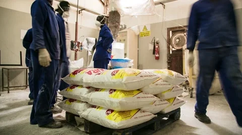 Time Lapse of African Workers Stacking Plastic Bags in Factory Stock Footage 61131380