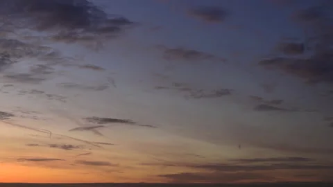 Time lapse. After sunset sky with soft, fluffy, blurred pastel colored clouds Stock-Footage 166681349