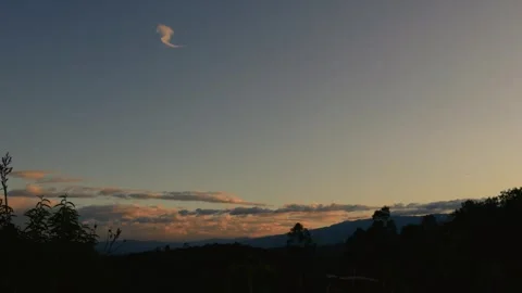 Time-lapse of the afterglow in a fairly clear sky over the eastern Andean mou Stock Footage 281792914