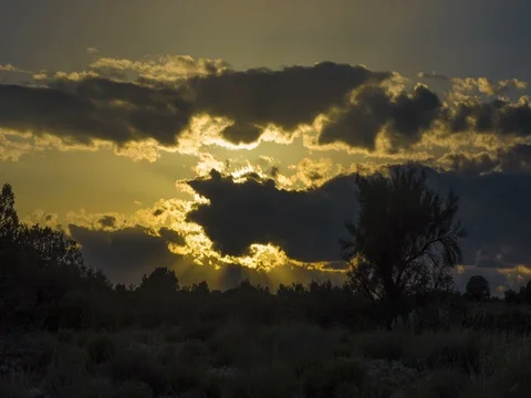 Time lapse of afternoon sun rays and cloud formations Stock Footage 74755987