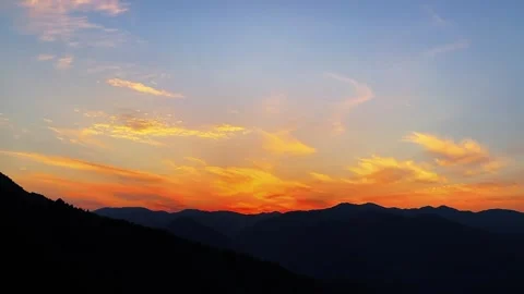 Time-lapse of Ailao Mountain Range Under Golden Orange Sunset Stock Footage 332383283