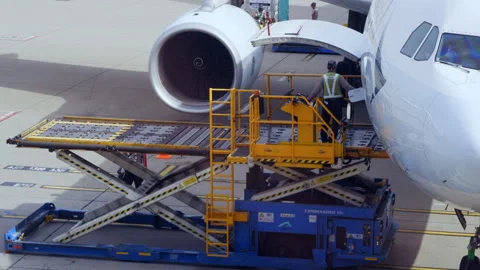 Time-lapse of aircraft loader loading in pallets of cargo, 4K Stock Footage 306676826