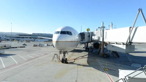 Time lapse of airplane arriving at gate Stock Footage 57210658