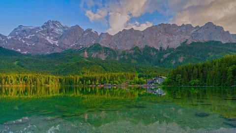 Time lapse alpine lake with crystal clear water reflecting rugged mountain peaks Stock Footage 340076981