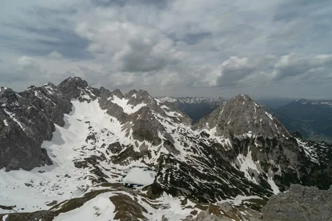 Time lapse of alps near ehrwald, austria, spring, snow, drachenkpopf, drachensee Stock Footage 138919393