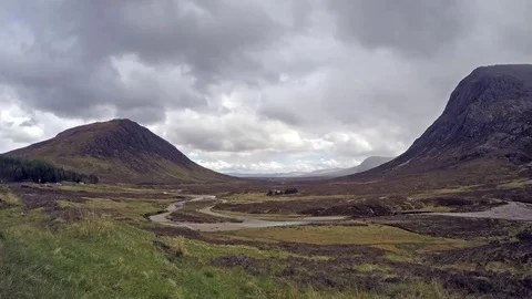 Time lapse of the amazing landscape of Glencoe with sun, rain, hail and rainbow Stock Footage