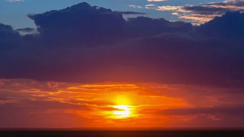Time lapse of amazing red sunset with flowing clouds Stock Footage 75327640