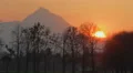 Time-lapse of amazing sunset behind mountain, beautiful nature HD Footage