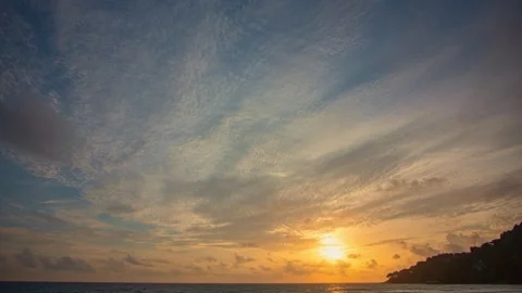 Time lapse amazing sunset, clouds float above the surface of the sea. 스톡 동영상 249372407