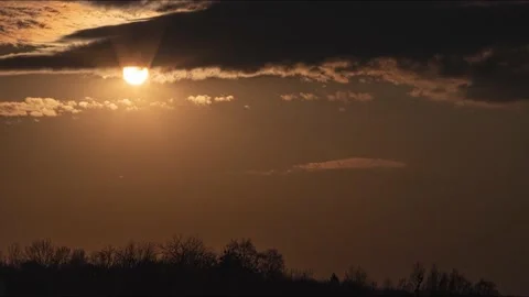 Time lapse amazing sunset with floating clouds going to darkness. 4K Video stock 130352893