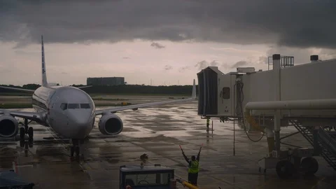 Time-lapse of an American Airlines docking the terminal to unload passengers Stock Footage 129389687