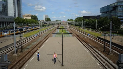 Time Lapse of Amsterdam with People Wait in Train Station Netherlands Transport Stock Footage 99275907